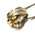 Anhänger aus Silber mit Gold (750). 359,- €